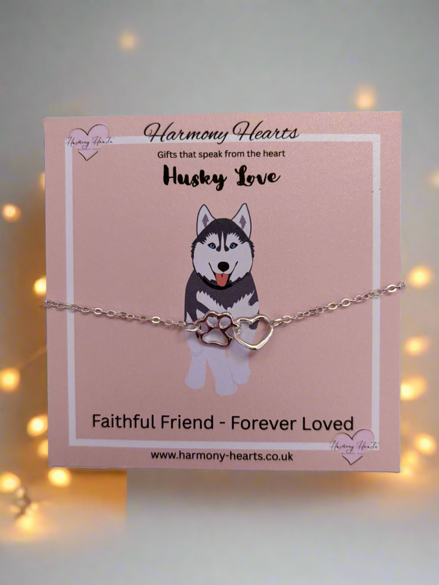 Dog bracelet on a pink card with 'Harmony Hearts' branding, featuring a husky illustration.