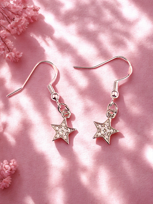 Silver star shaped earrings with sparkly stones on silver hooks