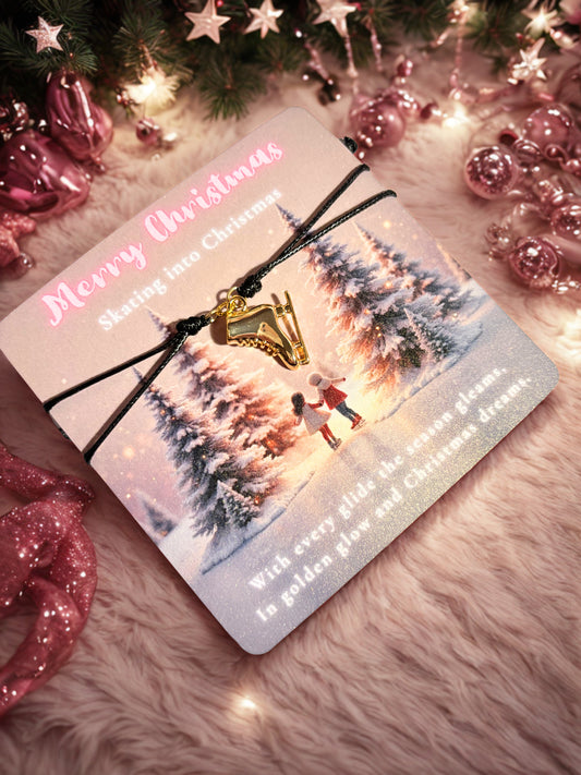 Christmas card with a gold ice skate charm on a festive background