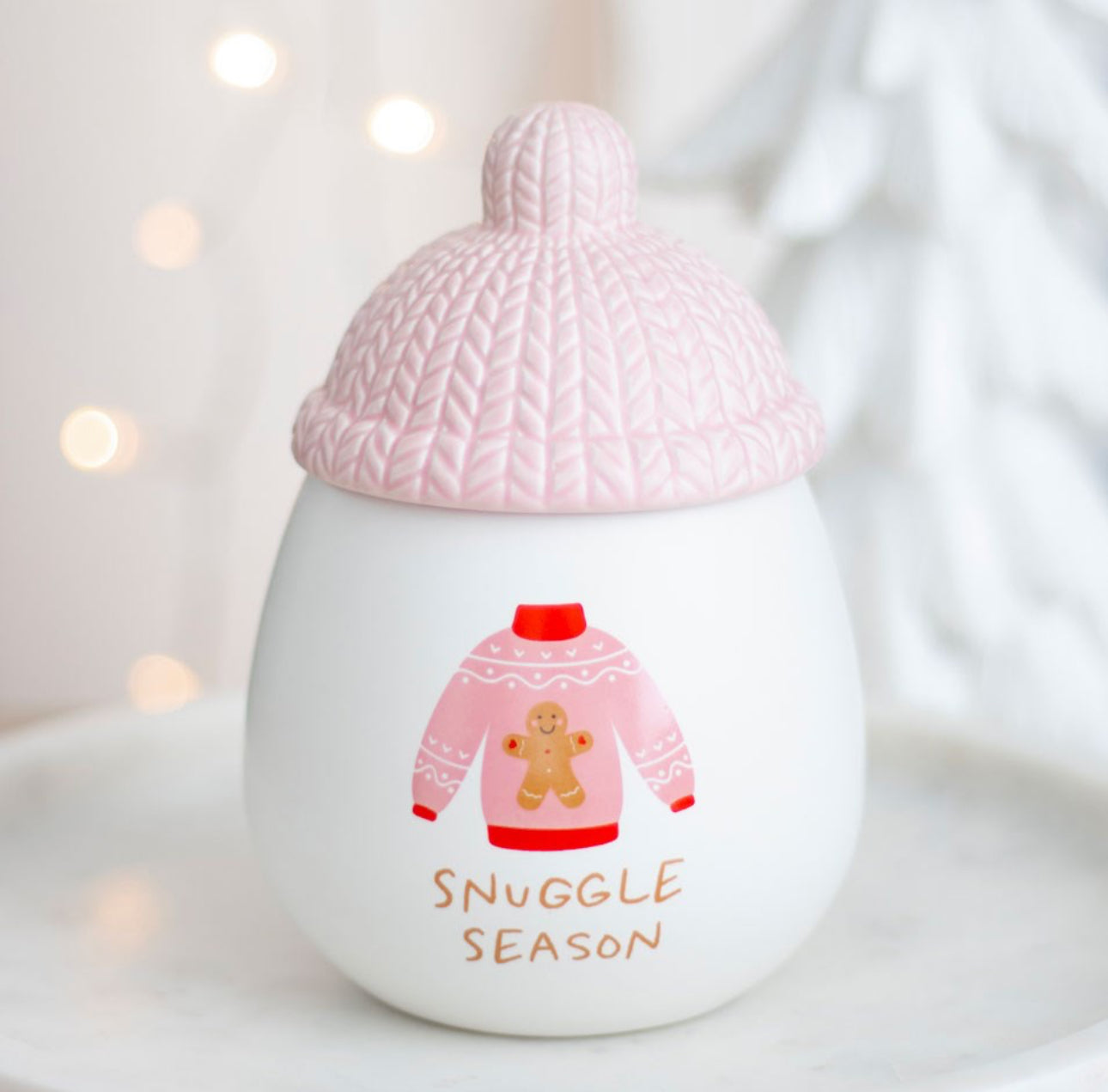 Oil burner with bobble hat and gingerbread design on a jumper