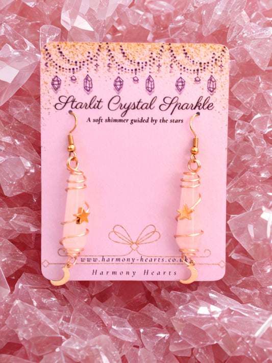 Starlit Crystal Sparkle earrings rose quartz on a pink card with decorative crystals in the background