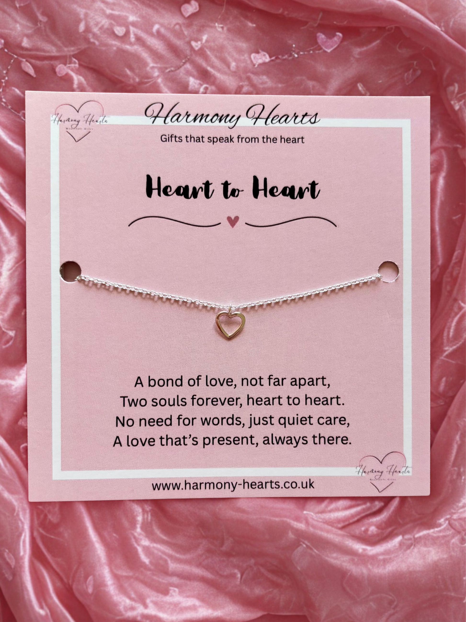 Silver heart bracelet on poem card