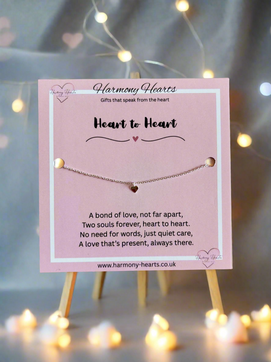 Bracelet on a pink card with 'Harmony Hearts' branding and product description.