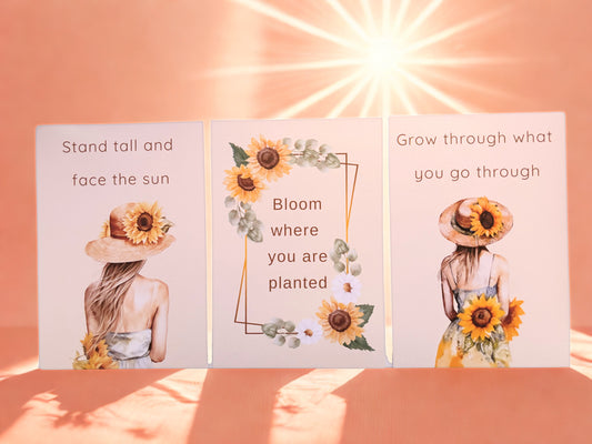 Three motivational cards with sunflower designs and inspirational quotes on a peach background.