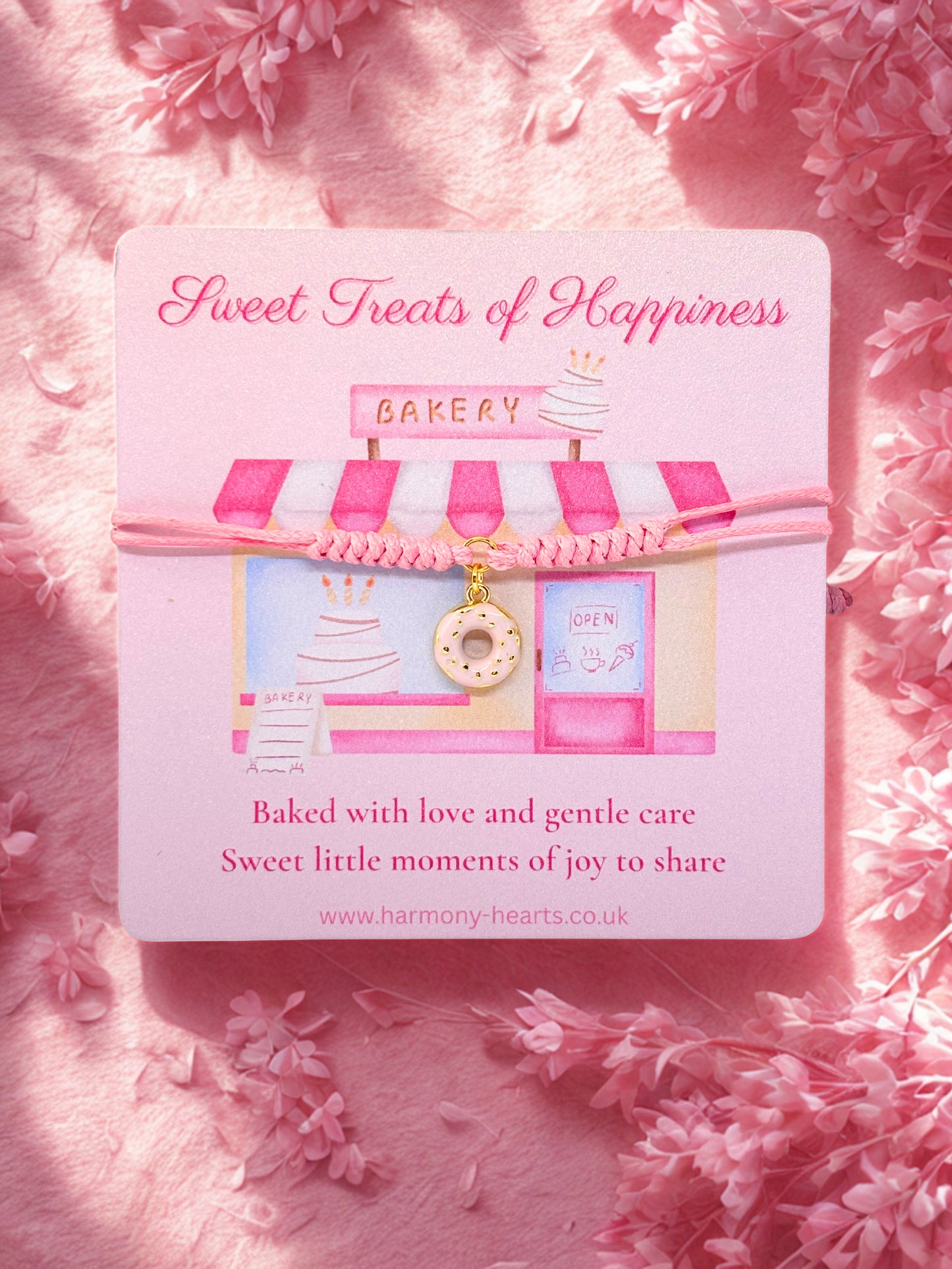 Donut Charm bracelet presented on a Card with 'Sweet Treats of Happiness' bakery design on a pink floral background