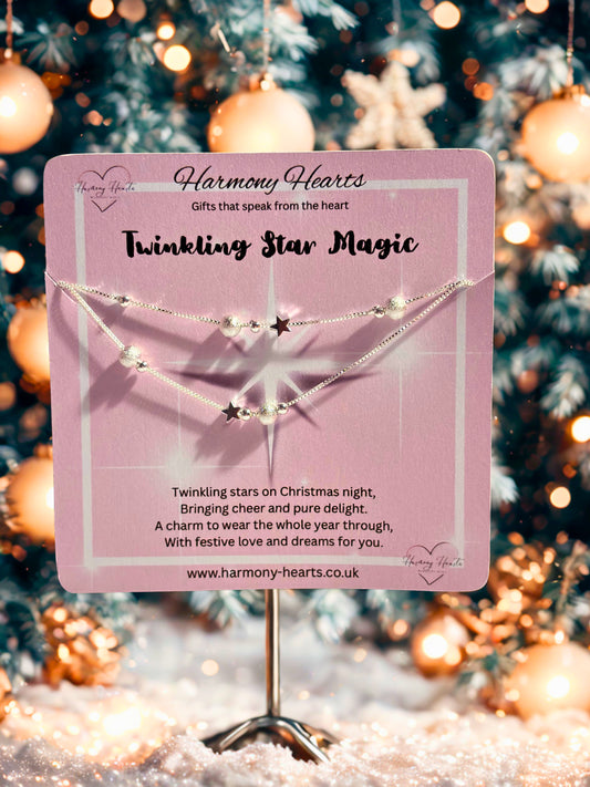 Bracelet with star charms on a pink card against a festive background