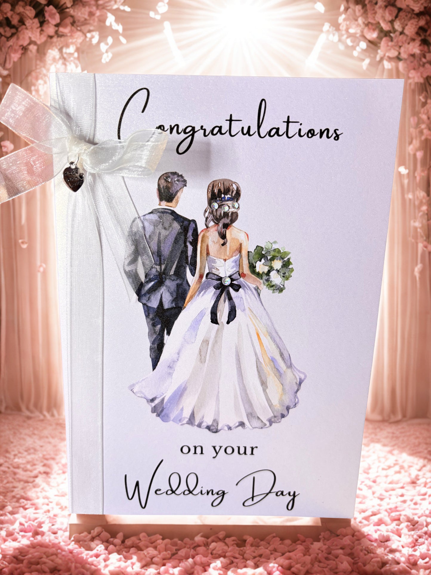 Wedding card with a couple illustration and 'Congratulations on your Wedding Day' text, surrounded by decorative elements.