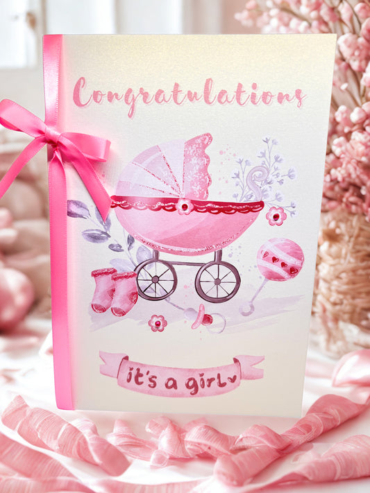 Baby shower card with pink baby carriage and 'Congratulations it's a girl' text, surrounded by pink ribbons and flowers.