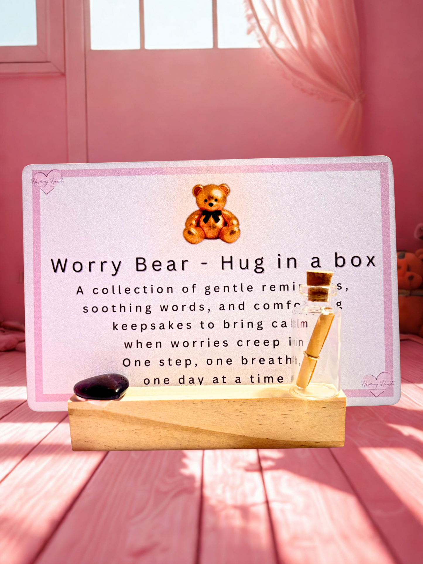 Product packaging with a bear illustration and text on a pink background