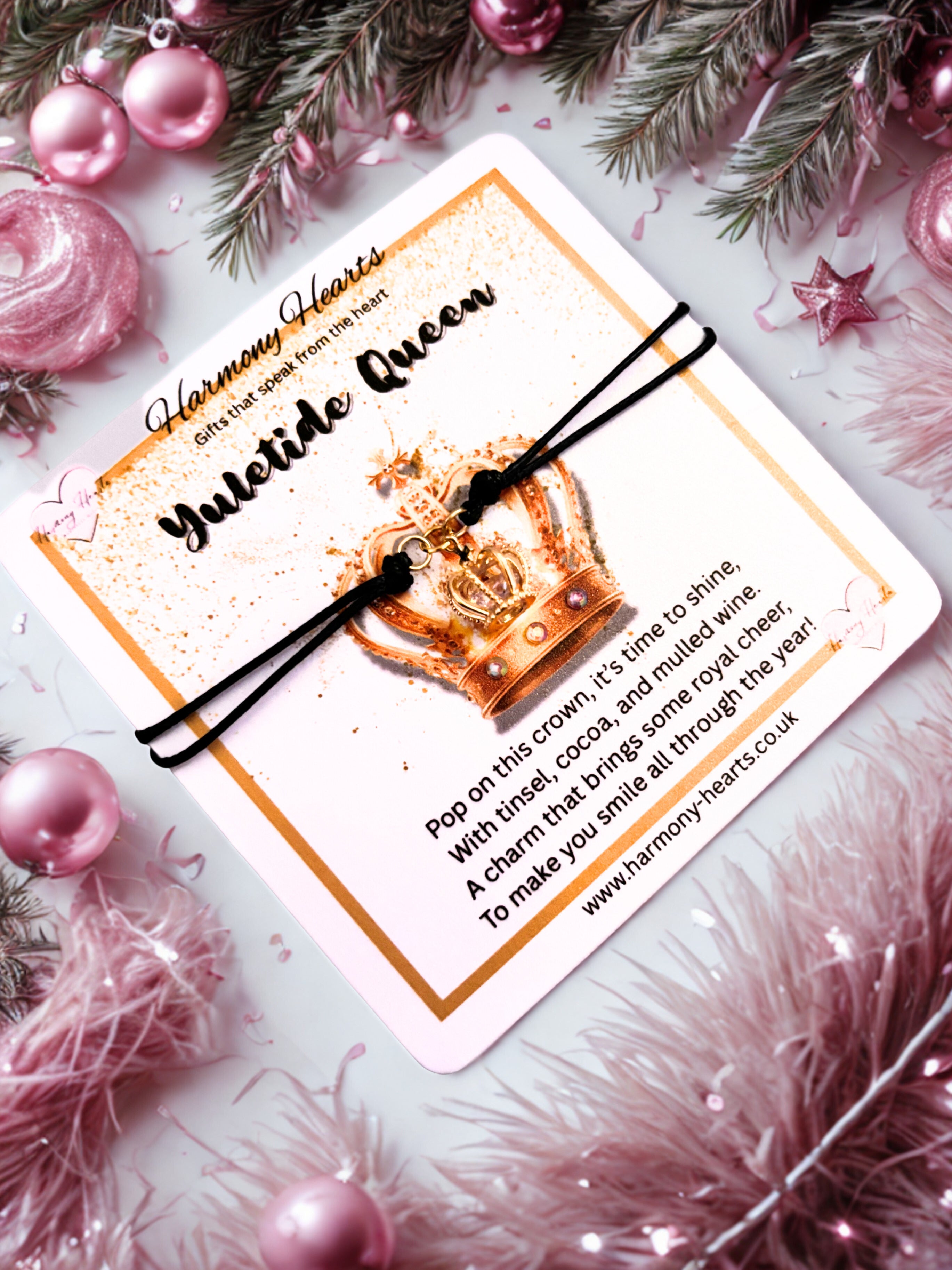 Yuletide Queen gold crown bracelet on a decorative card with Christmas elements